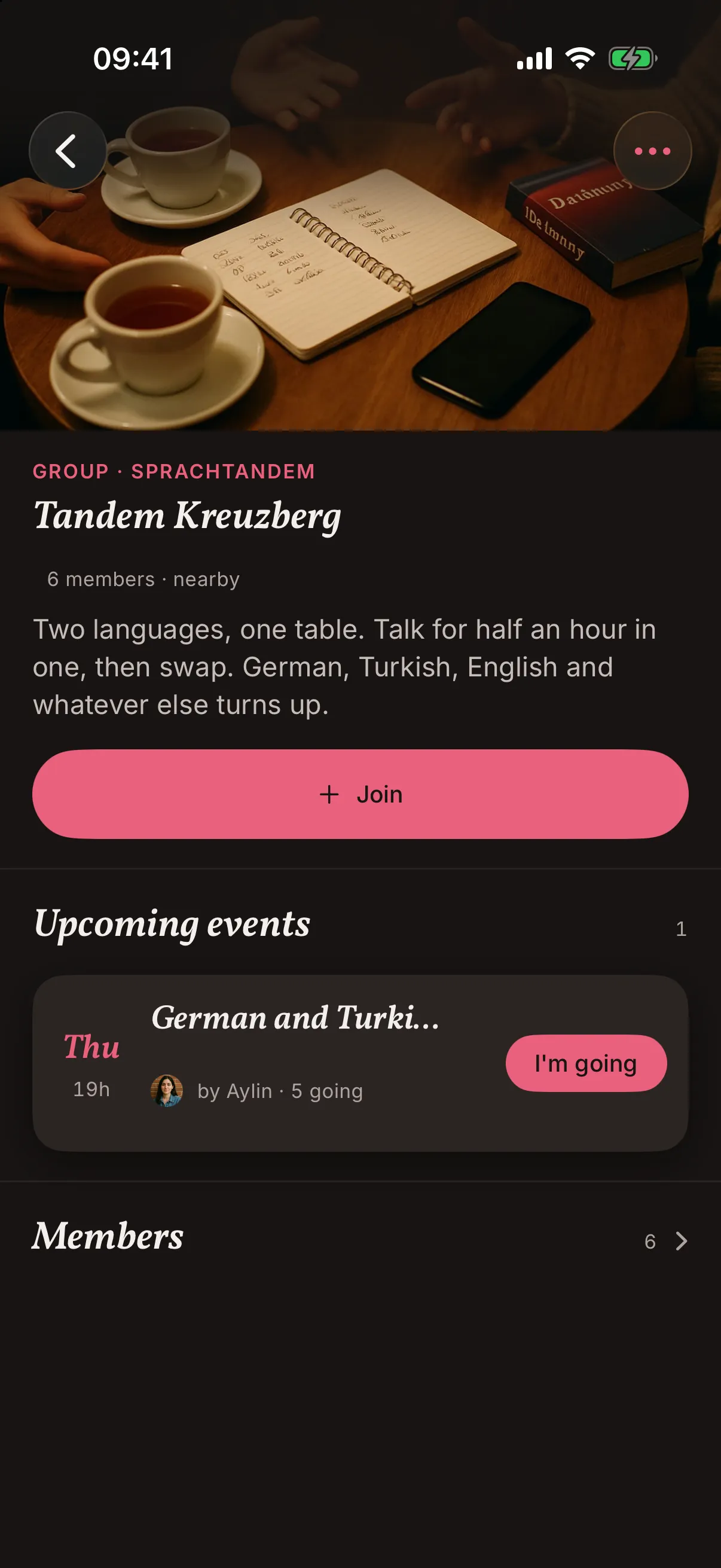 A group in the snakken app: Tandem Kreuzberg with a photo of a café table set for a language evening, six members, one upcoming evening and a button to join.